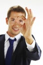 Portrait of handsome young man gesturing okay sign Royalty Free Stock Photo