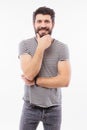 Portrait handsome young man with hand on beard smiling Royalty Free Stock Photo
