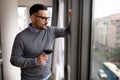 Portrait of handsome young man holding glass of red wine Royalty Free Stock Photo