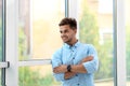 Portrait of handsome young man looking out window Royalty Free Stock Photo
