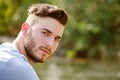 Portrait of handsome young man outdoors in nature Royalty Free Stock Photo