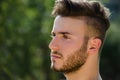 Portrait of handsome young man outdoors in nature Royalty Free Stock Photo