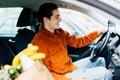 Portrait of handsome young man packing groceries into car , copy space Royalty Free Stock Photo