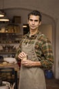 Handsome young man posing in pottery workshop Royalty Free Stock Photo