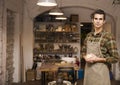 Handsome young man posing in pottery workshop Royalty Free Stock Photo