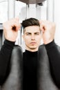 Portrait of a handsome young man training in a gym Royalty Free Stock Photo