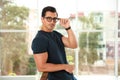 Portrait of handsome young man wearing glasses and leaning Royalty Free Stock Photo