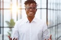 Portrait of handsome young smiling man in suit asking to make a choice between two products on his palms Royalty Free Stock Photo