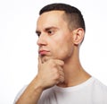 Portrait of handsome young thoughtful man isolated over white ba Royalty Free Stock Photo