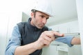 portrait handyman fixing furniture