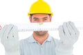 Portrait of handyman holding spirit level Royalty Free Stock Photo