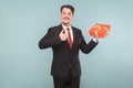 Portrait of happiness business man holding gift box, showing lik Royalty Free Stock Photo