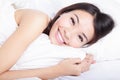 Portrait of happiness woman smile lying on bed Royalty Free Stock Photo