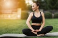 Portrait of happiness young woman practicing yoga on outdoors.Yoga and relax concept Royalty Free Stock Photo