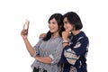 Portrait of happiness young women and her mother selfie with smartphone