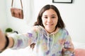 Portrait of a happy adolescent girl in her bedroom Royalty Free Stock Photo