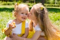 Portrait of happy adorable two sisters children girls outdoor. Cute little kid in summer day Royalty Free Stock Photo