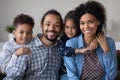 Portrait of happy affectionate African American family. Royalty Free Stock Photo