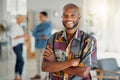 Portrait of a happy African american businessman standing with his arms crossed at work. One confident male manager Royalty Free Stock Photo