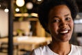 Portrait of happy african american casual businesswoman with afro in office, copy space Royalty Free Stock Photo