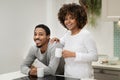 Portrait of happy african american couple drinking coffee at kitchen Royalty Free Stock Photo