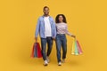 Portrait Of Happy African American Couple Walking With Bright Shopping Bags Royalty Free Stock Photo