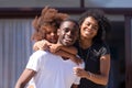 Portrait of happy African American family posing outside Royalty Free Stock Photo