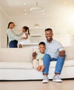 Portrait of happy African American family relaxing, bonding and spending free time together at home. Carefree parents Royalty Free Stock Photo