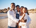 Portrait of a happy african american family with two children standing together on the beach. Loving mother and father Royalty Free Stock Photo