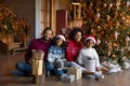 Portrait happy African American family wearing festive caps celebrating Christmas Royalty Free Stock Photo