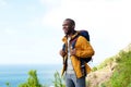 Happy african american man with backpack outdoors Royalty Free Stock Photo