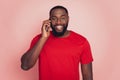 Portrait of happy african american man making call smartphone isolated over pink studio background Royalty Free Stock Photo