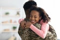 Portrait of happy african american teen girl hugging dad soldier Royalty Free Stock Photo