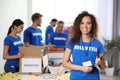 Portrait of happy African-American volunteer in uniform Royalty Free Stock Photo