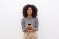 Happy african american woman holding smart phone Royalty Free Stock Photo