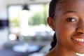 Portrait of happy african american woman looking at camera and smiling at home Royalty Free Stock Photo