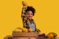 Portrait of happy African child boy farmer with afro hairstyle standing smiling and holding fresh cacao fruit on hand isolated on Royalty Free Stock Photo