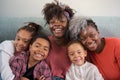 African horizontal extended family looking at camera and smiling at home. Royalty Free Stock Photo