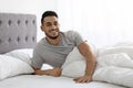 Portrait Of Happy Arab Man Waking Up In Bed In The Morning