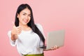 Woman confident smiling face holding using laptop computer and showing thumb up Royalty Free Stock Photo