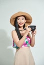 Portrait of happy Asian beautiful young woman photographer holding vintage digital mirrorless photo camera on hands Royalty Free Stock Photo
