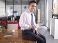 Portrait of a happy asian business executive in office Royalty Free Stock Photo