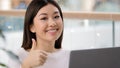 Portrait happy asian business woman portrait posing workplace showing cool thumb up gesture smiling agree super good Royalty Free Stock Photo