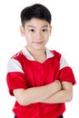 Portrait of Happy asian cute boy in red sport uniform Royalty Free Stock Photo