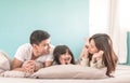 Portrait Happy Asian Family in bedroom looking at each other. Royalty Free Stock Photo