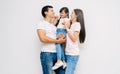 Portrait of happy Asian family with daughter, teasing dad and mommy. on white background. Weekend activity happy family lifestyle Royalty Free Stock Photo