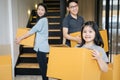 Portrait of happy Asian family moving to new house with cardboard boxes. Royalty Free Stock Photo