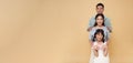 portrait happy asian family standing together isolated on color copy space background Royalty Free Stock Photo