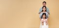 portrait happy asian family standing together isolated on color copy space background Royalty Free Stock Photo