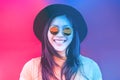 Portrait of happy asian girl smiling with vintage sunglasses - Young chinese woman having fun posing in front of the camera - Royalty Free Stock Photo